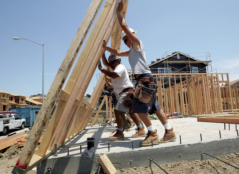 workers setting up a frame