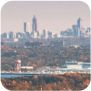 Scenic hilltop view revealing the city skyline